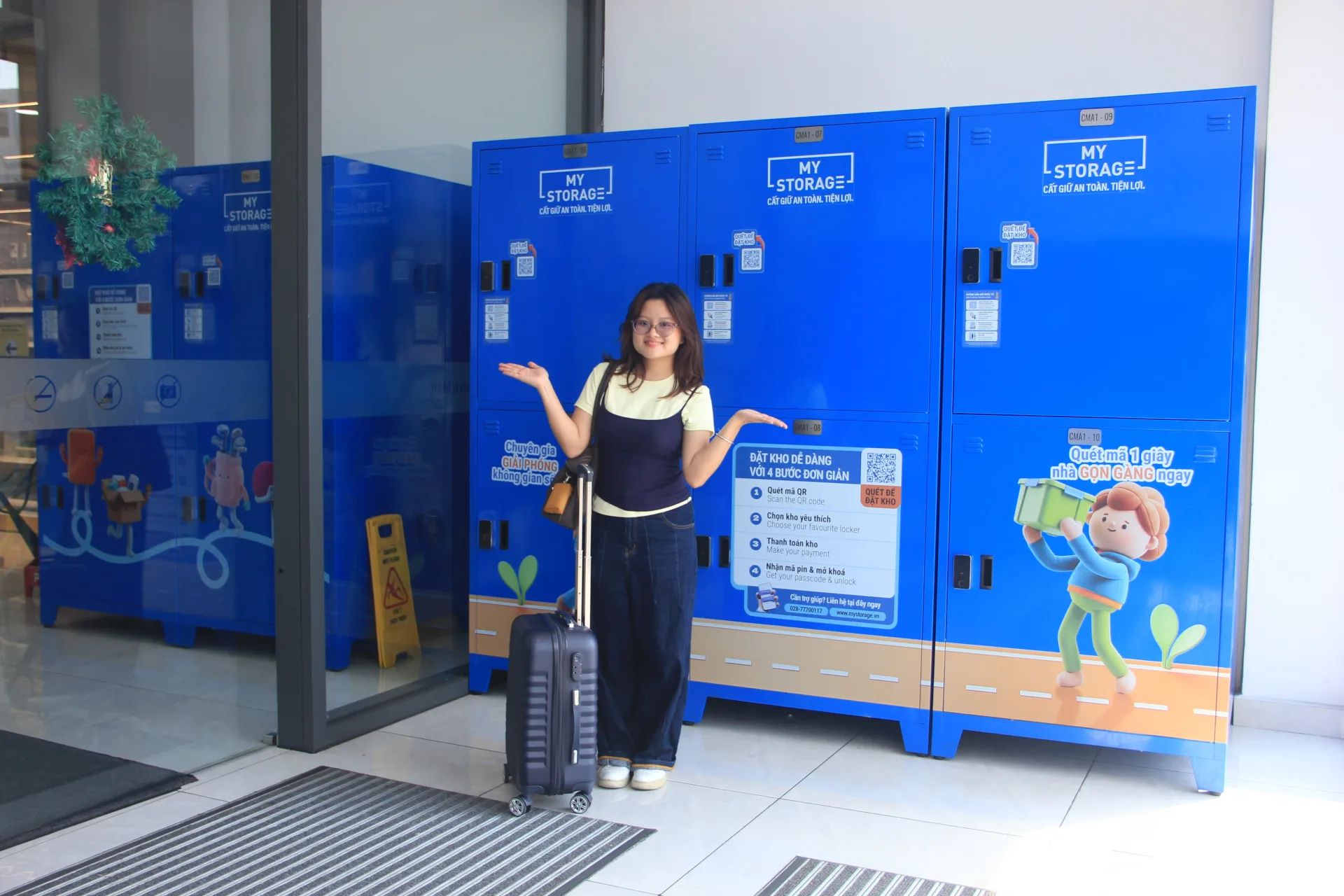 A customer presenting the MyStorage lockers available at Centre Mall District 6
