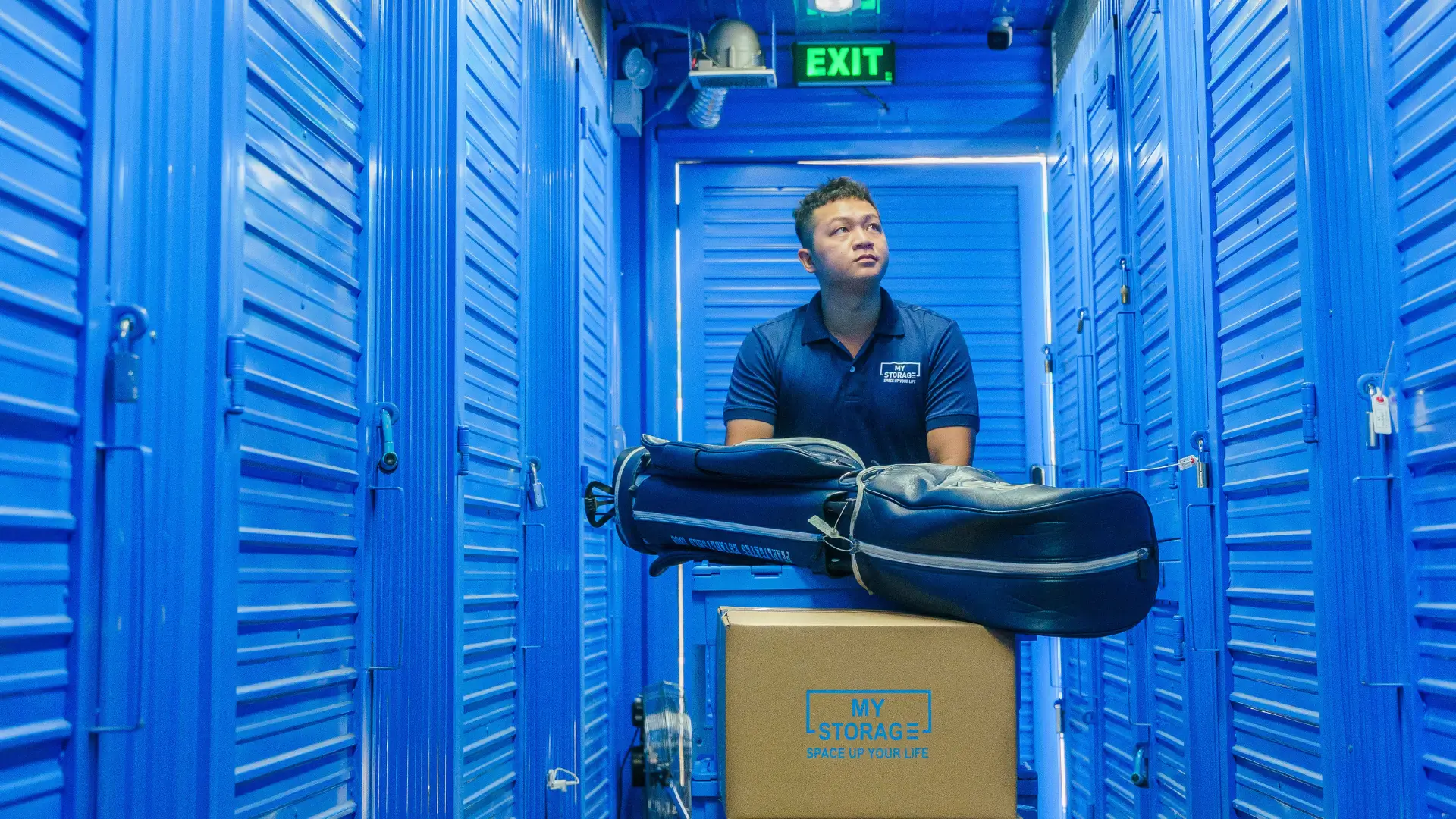 A man handling stored items in the air-conditioned warehouse