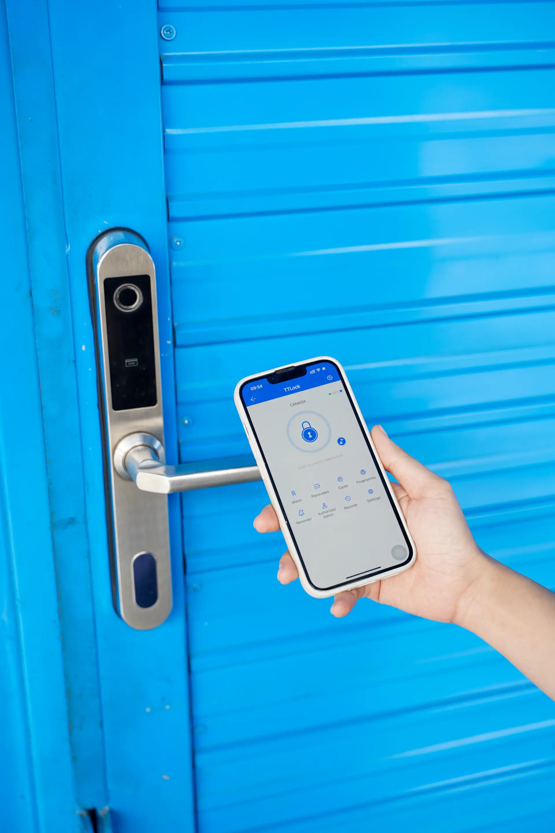 A smart lock on a MyStorage door being opened from a phone app