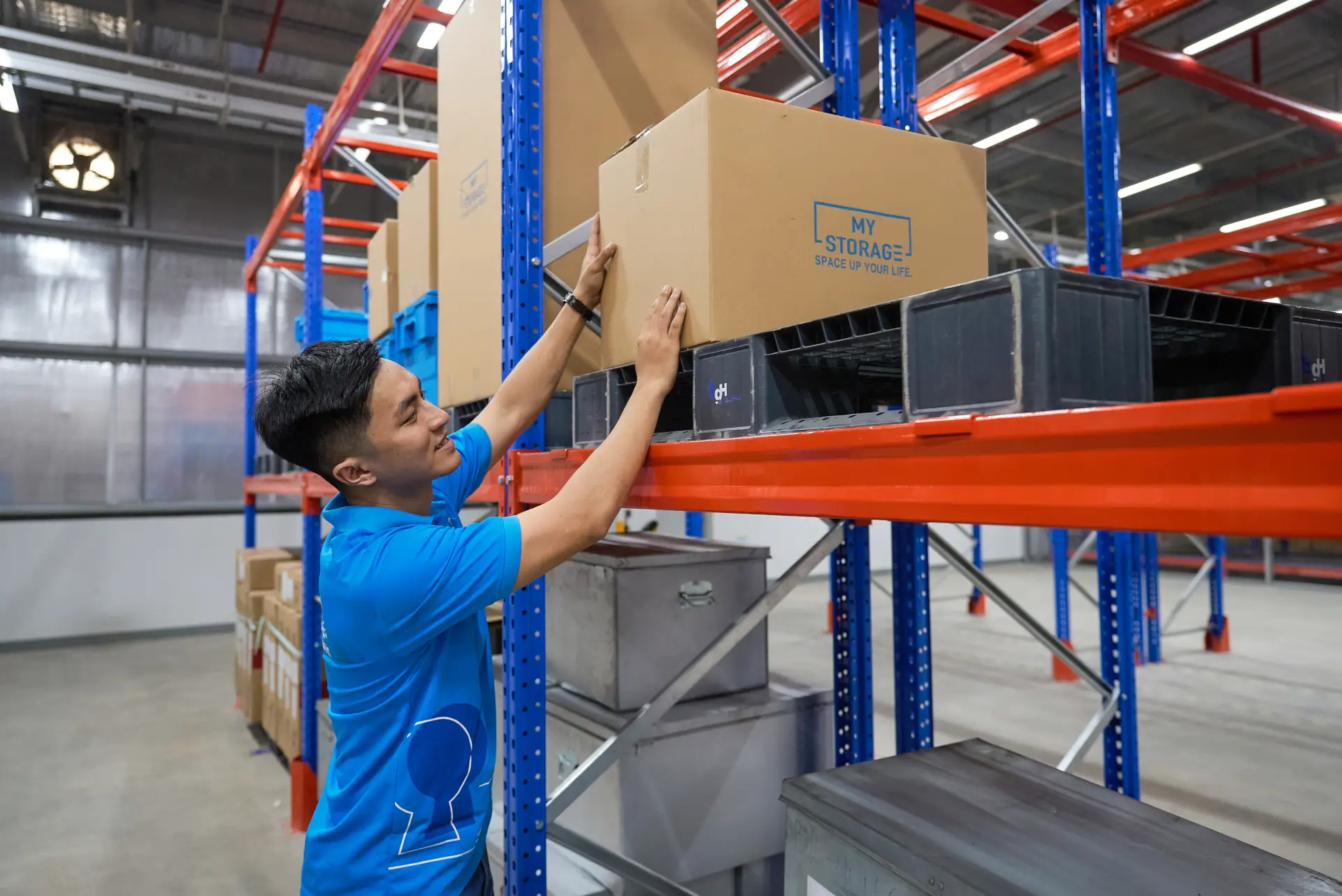 MyStorage team member in a blue shirt at the Dong Nai storage warehouse