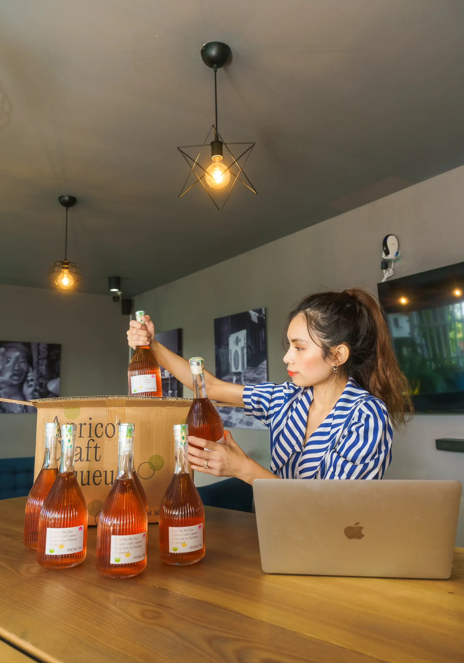 A woman handling bottles stored on a shelf