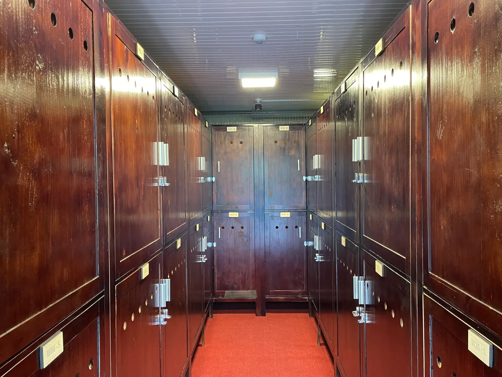 Hallway between the wooden wine lockers at MyStorage