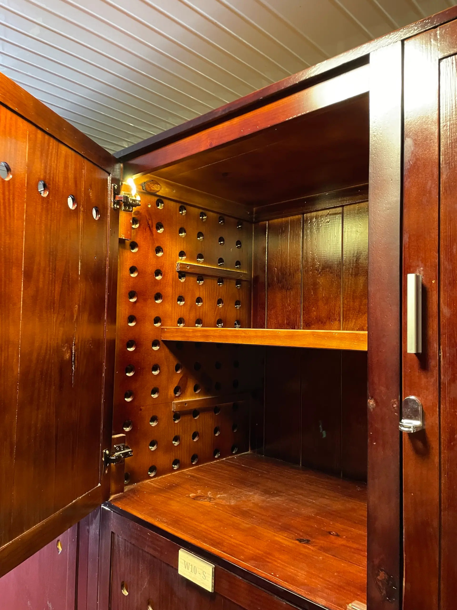 Open wooden wine cabinet at MyStorage