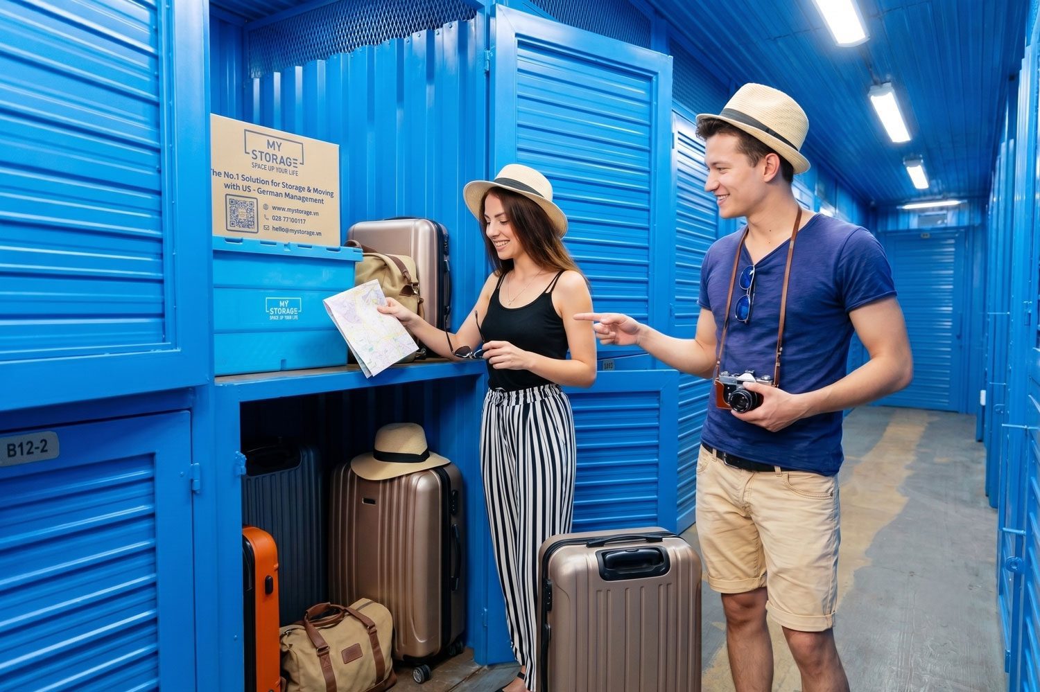 Two travelers leaving their suitcases in a storage unit